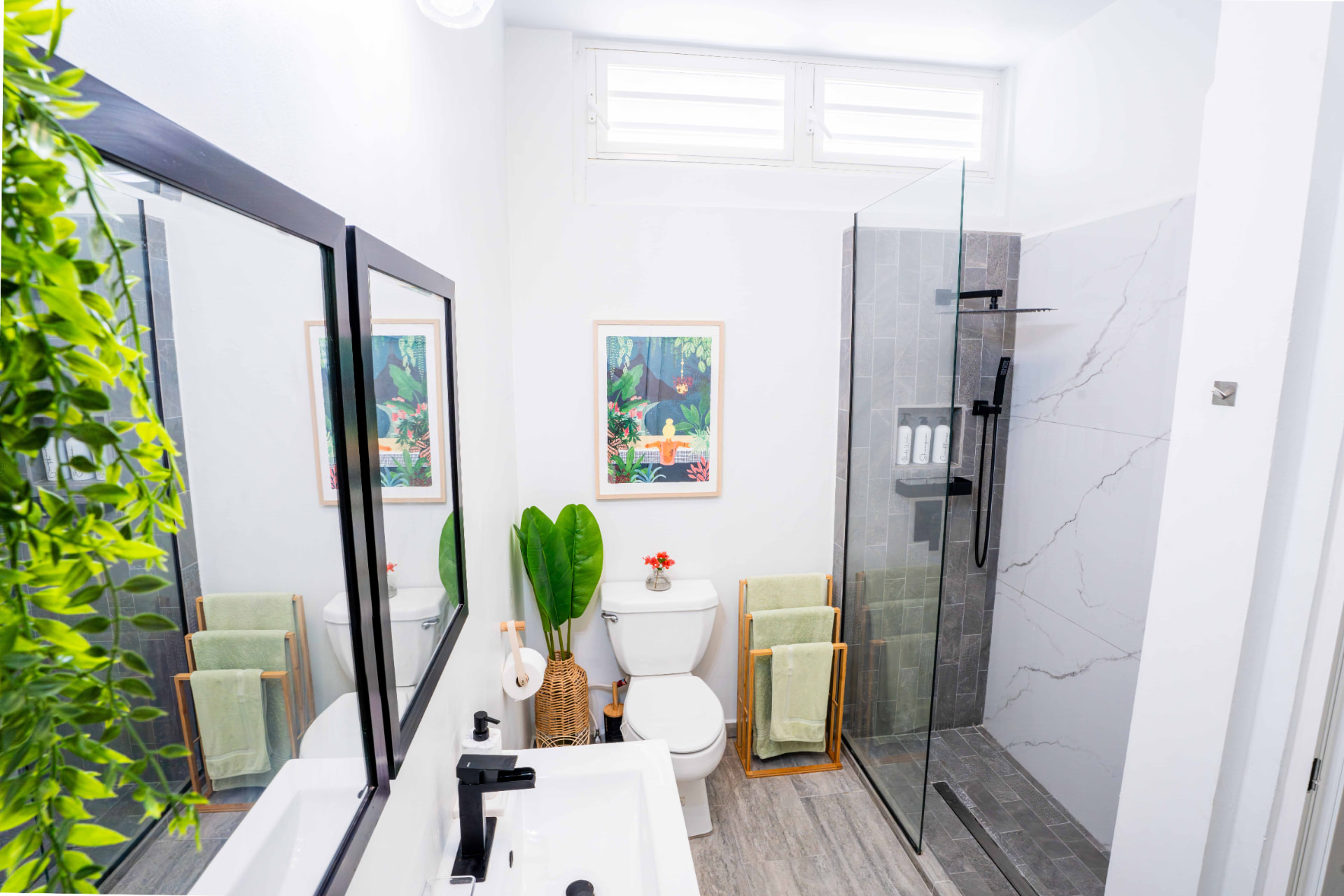 Modern bathroom with walk in rain shower and greenery