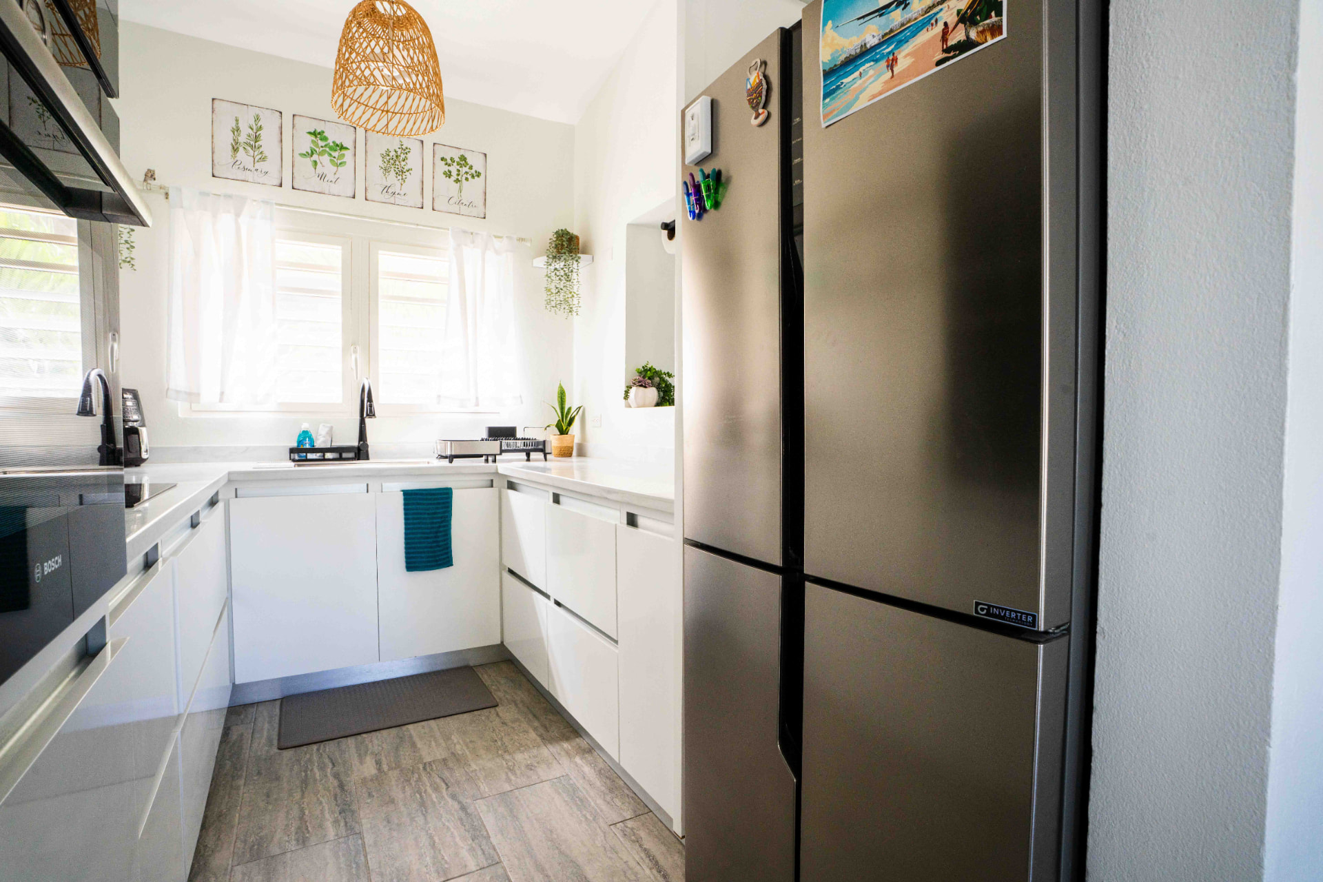 Kitchen with full size fridge freezer and prep space