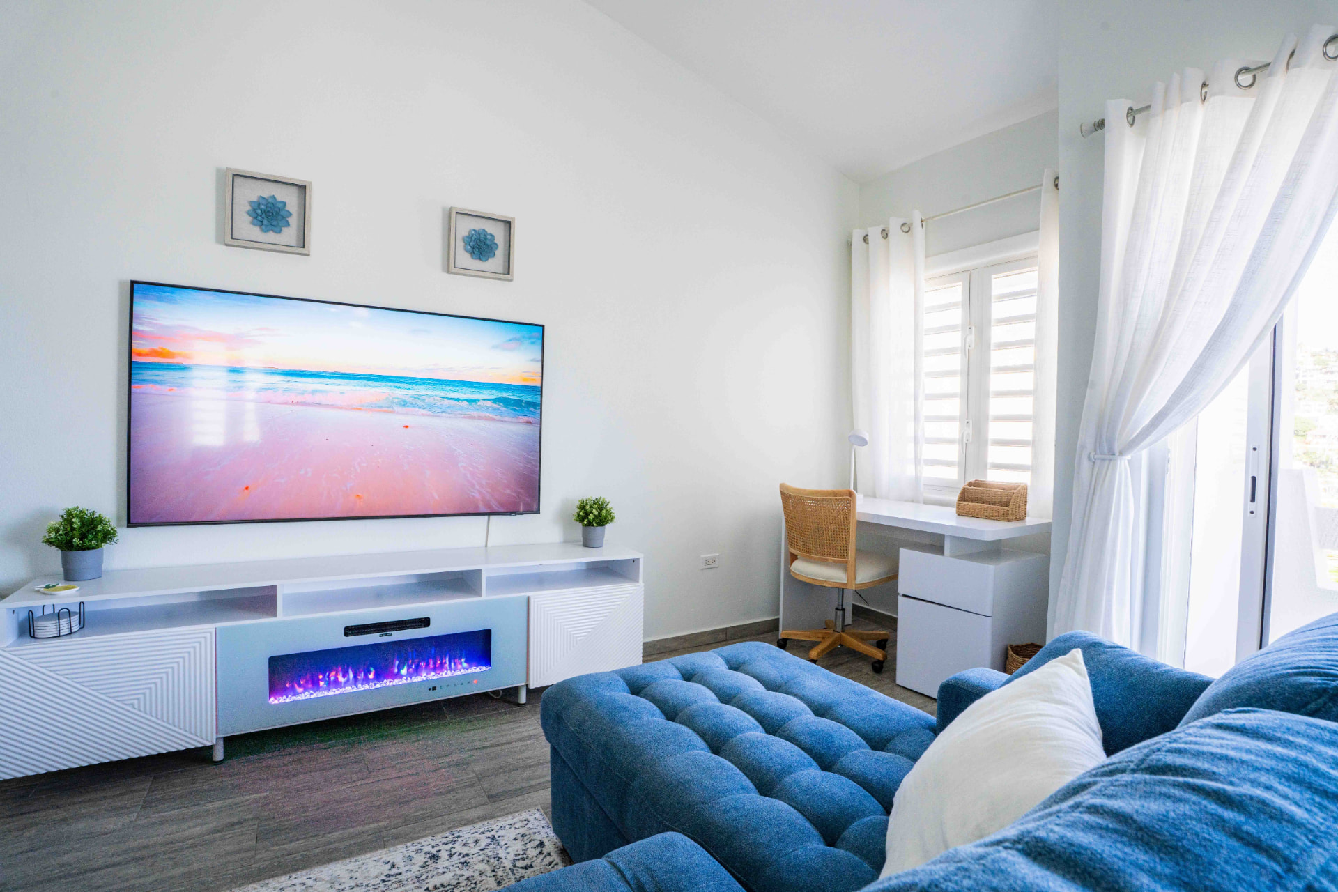 Living room seating with desk and bright terrace doors